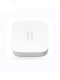 Smart Vibration Sensor Alarm placed on an opened book, showcasing its compact and sleek design.
